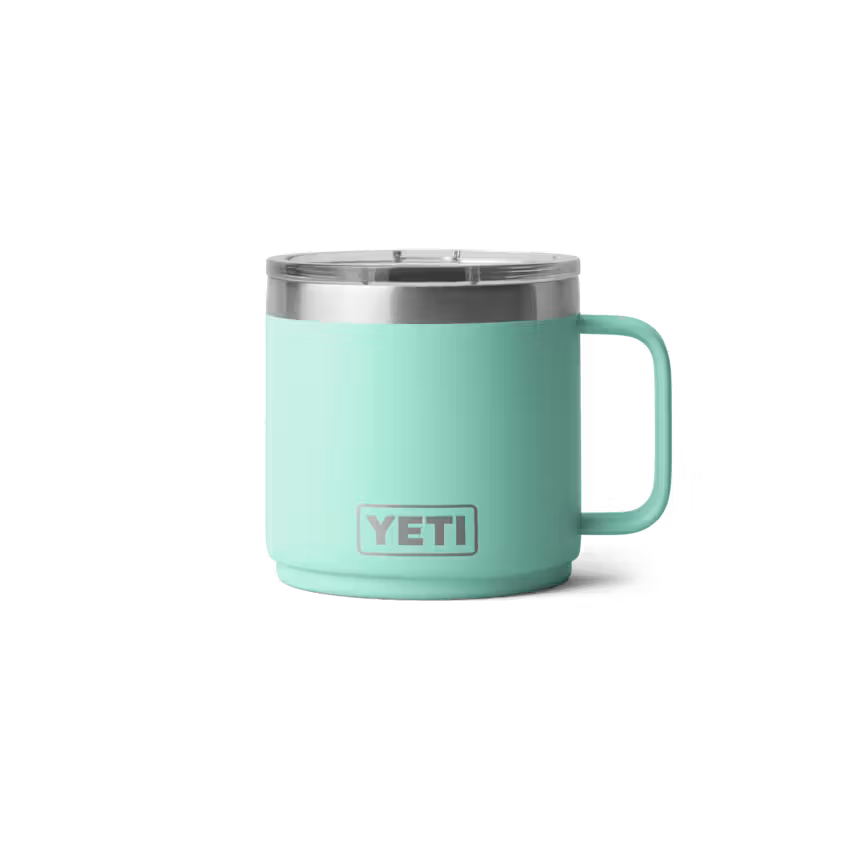 Mint green YETI mug with a silver rim on a white background