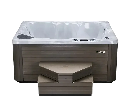 Hot tub with steps featuring the Hybrid brand.