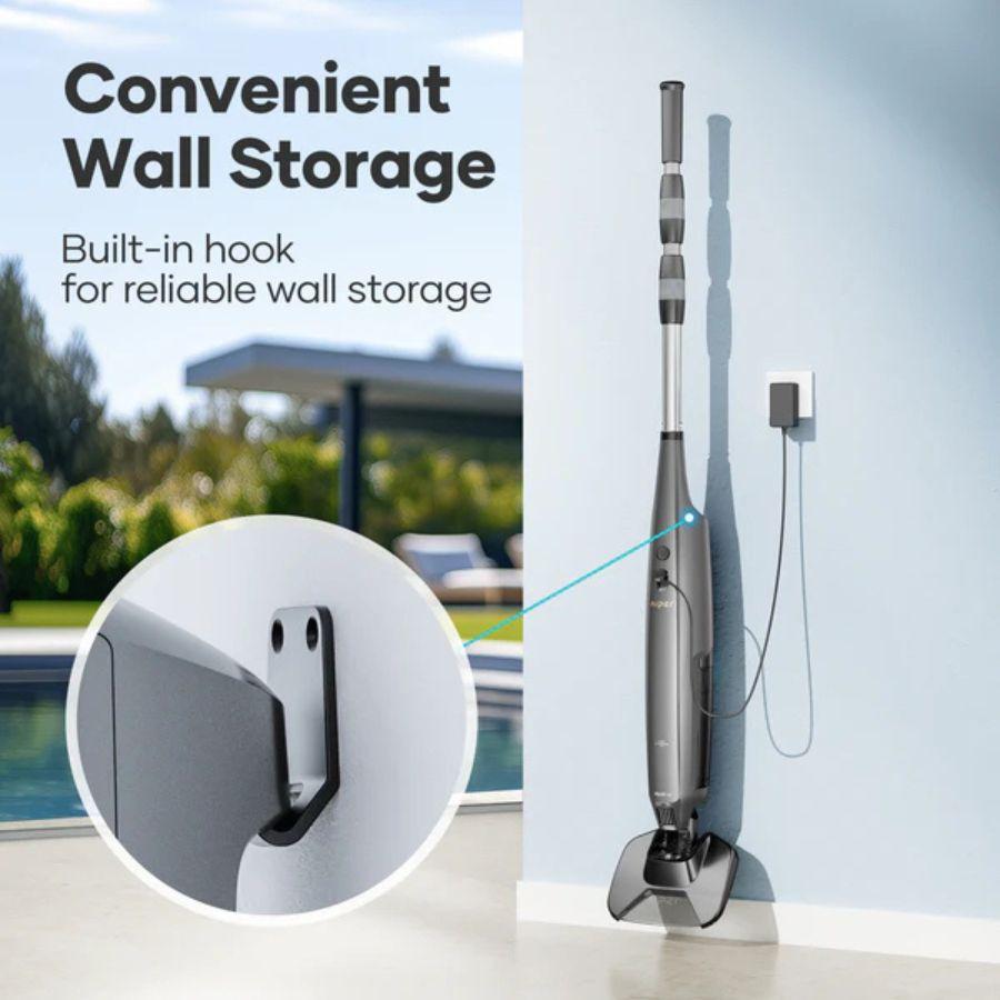 Pool Vacuum cleaner with a built-in hook for wall storage next to a pool.